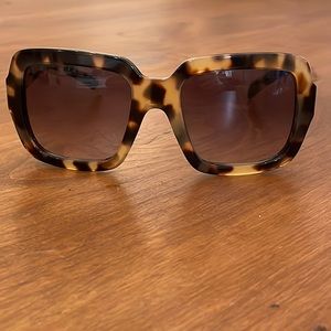 Women’s Prada sunglasses.